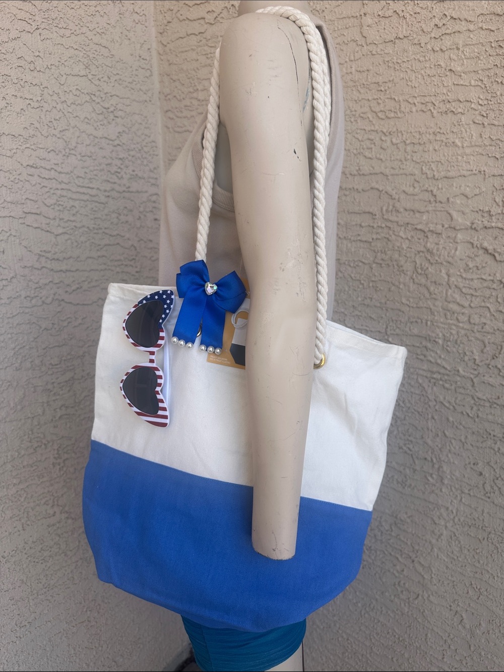 White and Blue Rope-Handle Tote Bag with Bow Accent and Heart Shaped Sunglasses
